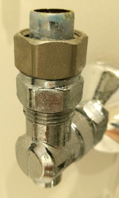 Isolator with short length of pipe attached to compression fitting on outlet.