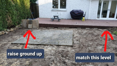 Started lifting patio slabs. A lot of sand underneath. Want to raise up to lip of deck so theres no step down.