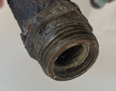 The lower end of the old stopcock removed. Fitting needed the same as this - shallower internally than the standard new brass 3/4 inch iron to 15mm compression fitting.