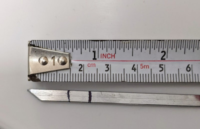 Depth of the drill hole (the 2nd line at the 2.3cm point on the tape measure)