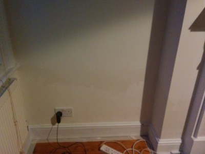 Dining room left of chimney breast - u can see water marks on the chimney breast too